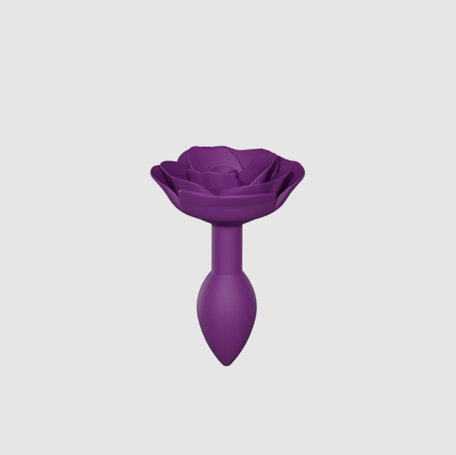 Plug anal en silicone souple avec une butée en forme de rose qui habille l'anus
